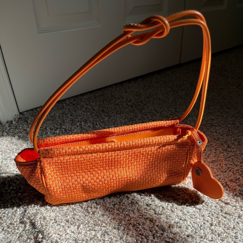 The SAK Orange Woven Shoulder Bag